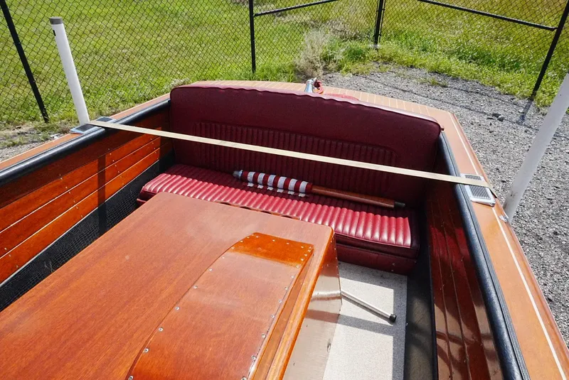 Slide: The Image of 1956 Chris-Craft Continental boat interior with red seating and wooden finish. - 5