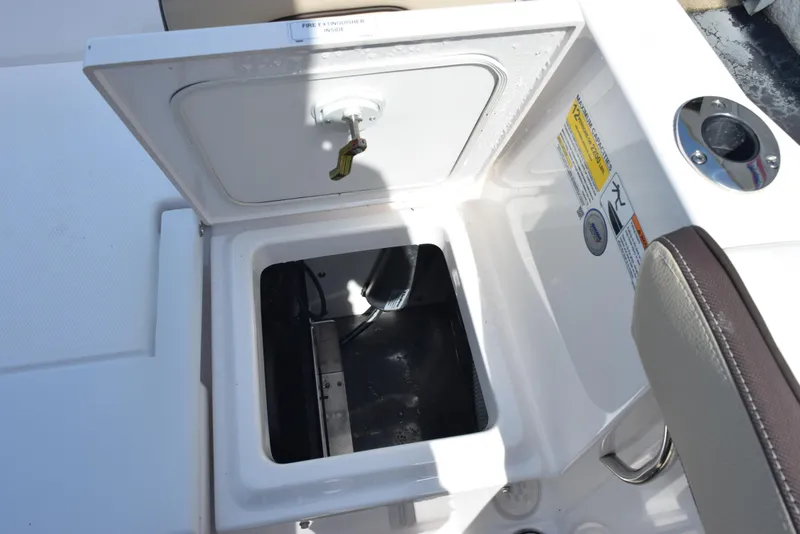 Slide: The Image of Open storage compartment on 2024 Yamaha Boats 255 FSH Sport H. - 22