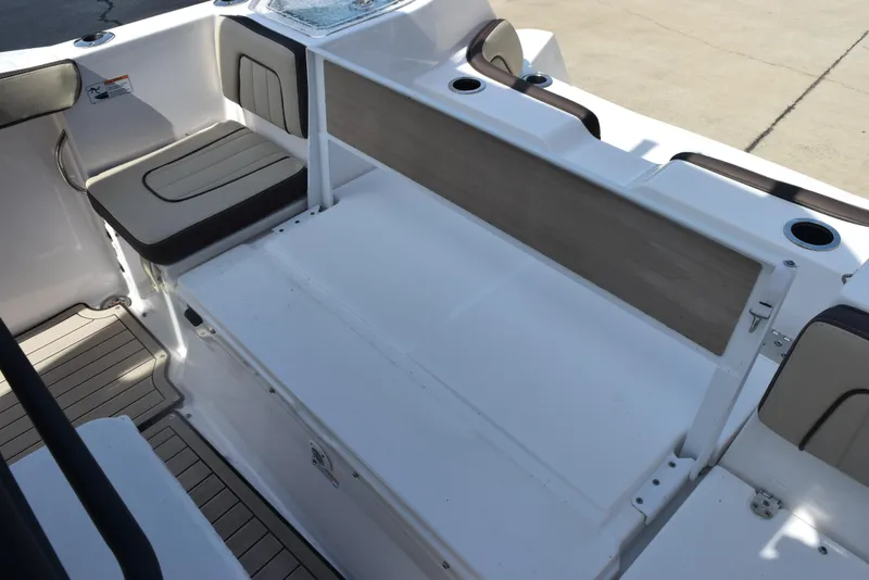Slide: The Image of 2024 Yamaha Boats 255 FSH Sport H interior seating and storage area. - 23