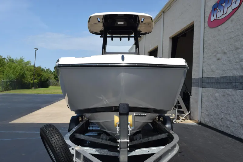 Slide: The Image of 2024 Yamaha Boats 255 FSH Sport H on trailer, parked outside a building. - 3