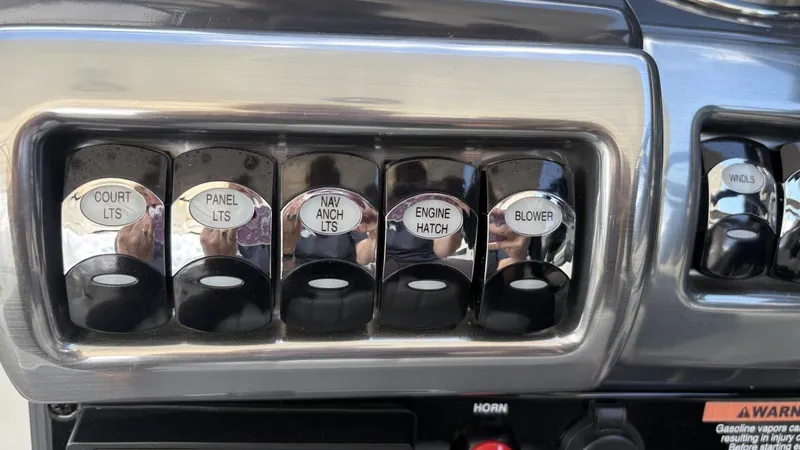 Slide: The Image of Control panel of a 2022 Formula 350 CBR boat with labeled switches. - 11