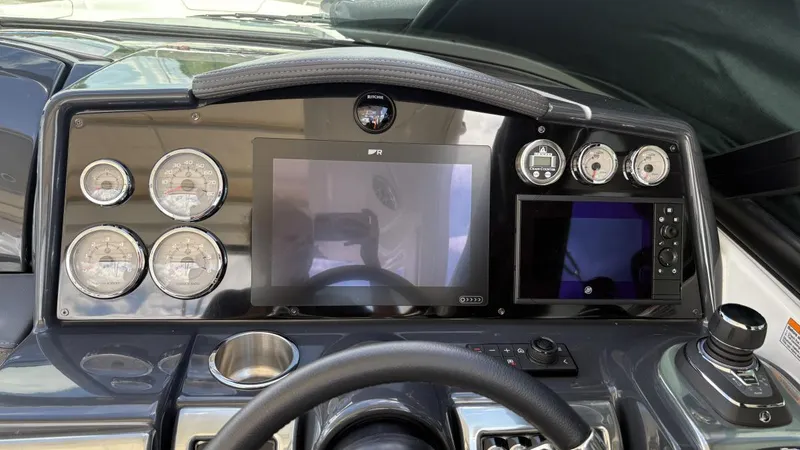 Slide: The Image of Dashboard of a 2022 Formula 350 CBR boat with gauges and digital displays. - 13