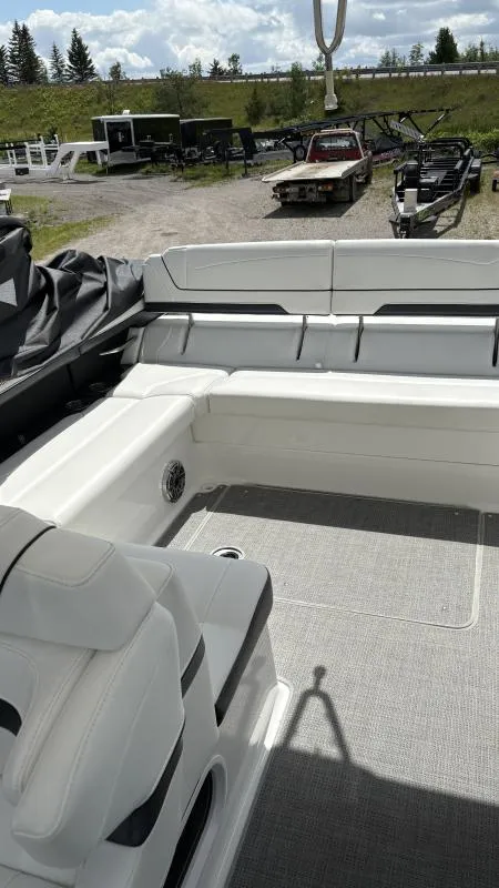 Slide: The Image of 2022 Formula 350 CBR boat interior with white seating and gray flooring. - 15