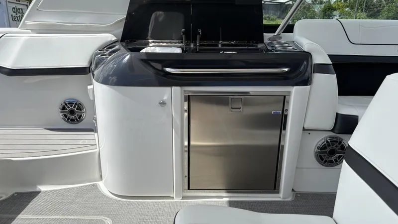 Slide: The Image of 2022 Formula 350 CBR boat interior with sleek kitchenette and stainless steel features. - 18