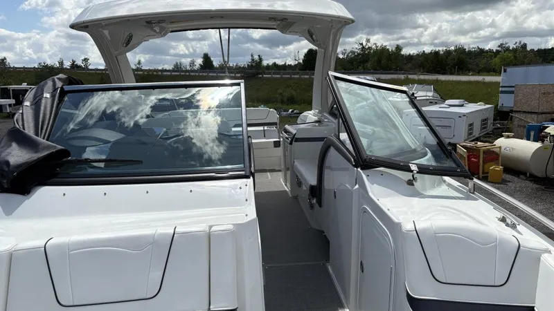 Slide: The Image of 2022 Formula 350 CBR boat with open cockpit and sleek design, parked outdoors. - 20