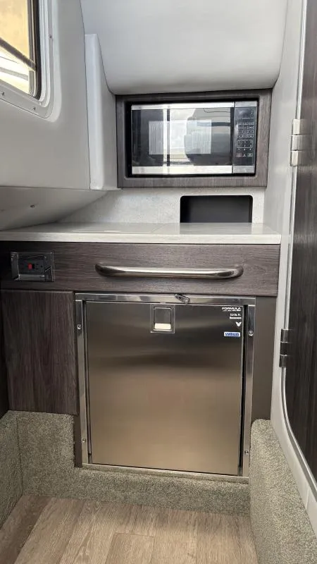 Slide: The Image of Interior of 2022 Formula 350 CBR boat with microwave and stainless steel fridge. - 28