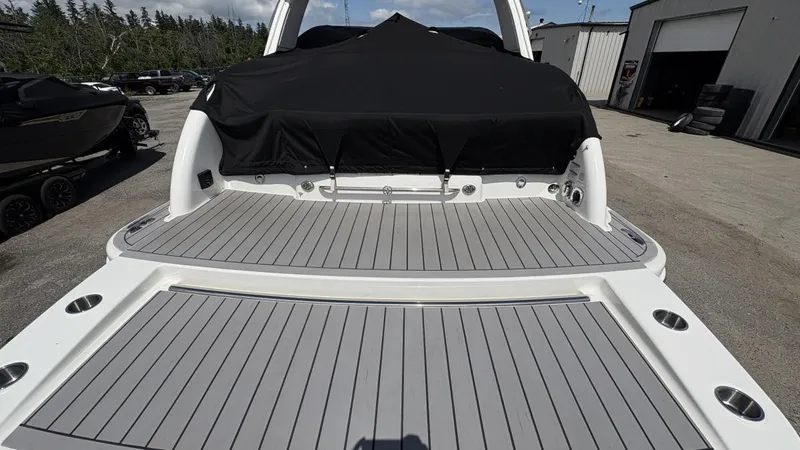Slide: The Image of 2022 Formula 350 CBR boat with covered seating area and spacious deck. - 36