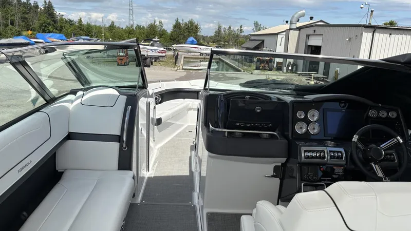 Slide: The Image of 2022 Formula 350 CBR boat interior with modern dashboard and seating. - 38