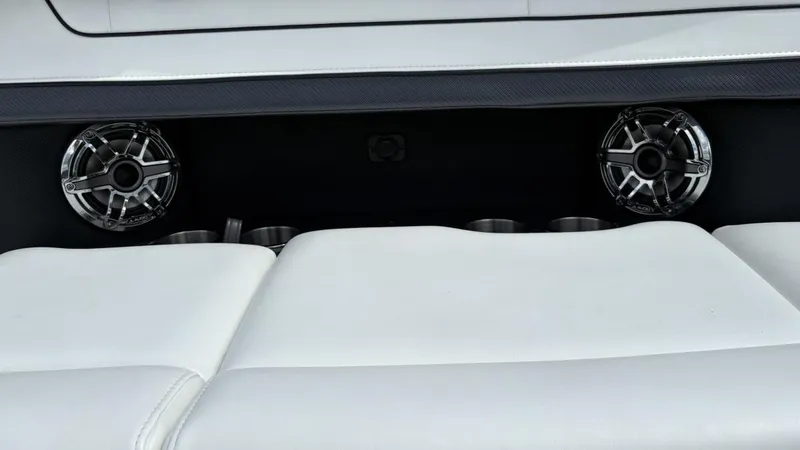 Slide: The Image of 2022 Formula 350 CBR boat interior with speakers and white seating. - 40
