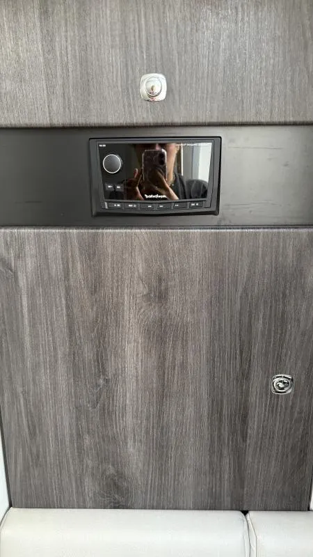 Slide: The Image of 2022 Formula 350 CBR interior with wood paneling and built-in audio system. - 43