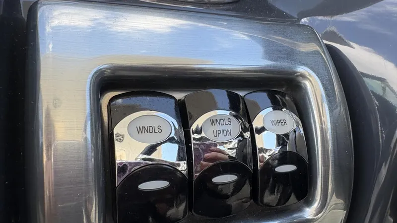 Slide: The Image of Control panel with switches for windows and wiper on a 2022 Formula 350 CBR. - 46