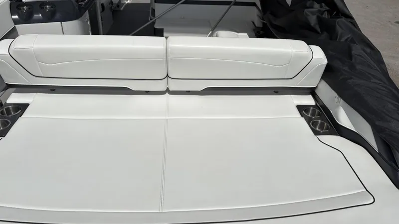 Slide: The Image of 2022 Formula 350 CBR boat interior with white seating and cup holders. - 5