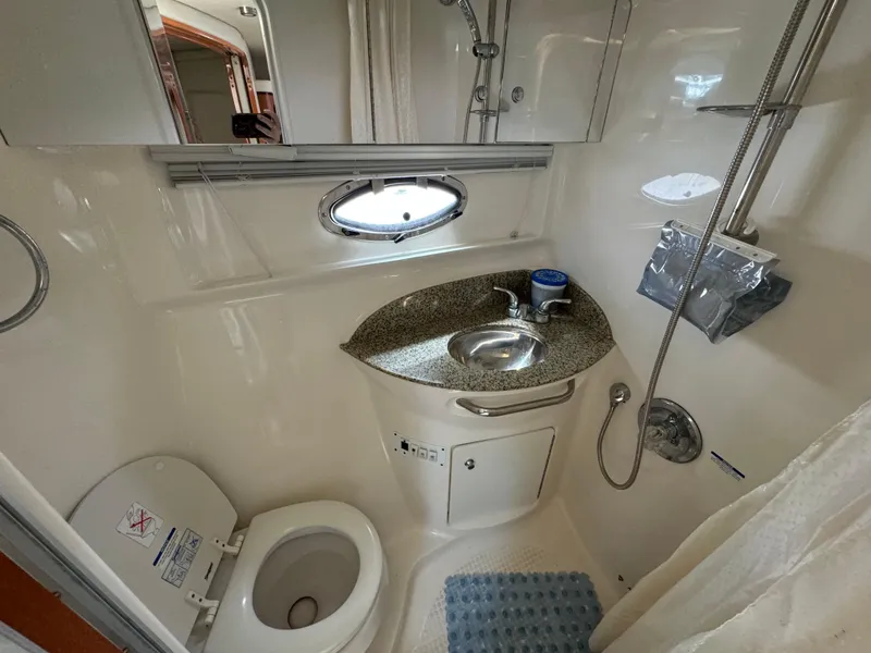 Slide: The Image of 2005 Chaparral Signature 350 bathroom with sink, toilet, and shower. - 12