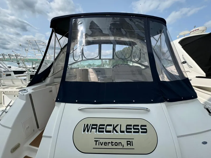 Slide: The Image of 2005 Chaparral Signature 350 boat with "Wreckless" name, Tiverton, RI, docked at marina. - 2