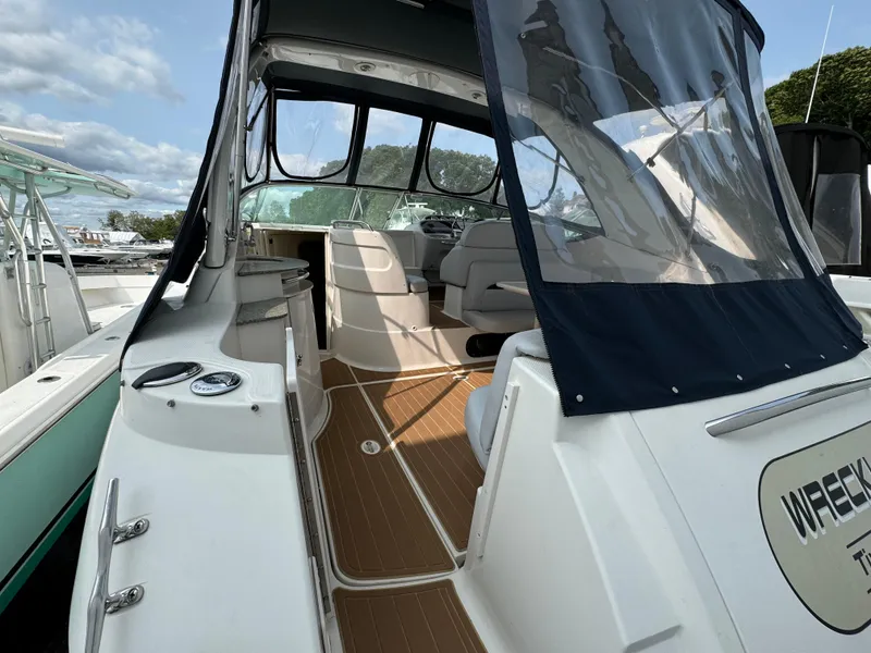 Slide: The Image of 2005 Chaparral Signature 350 boat interior with seating and clear canopy. - 3