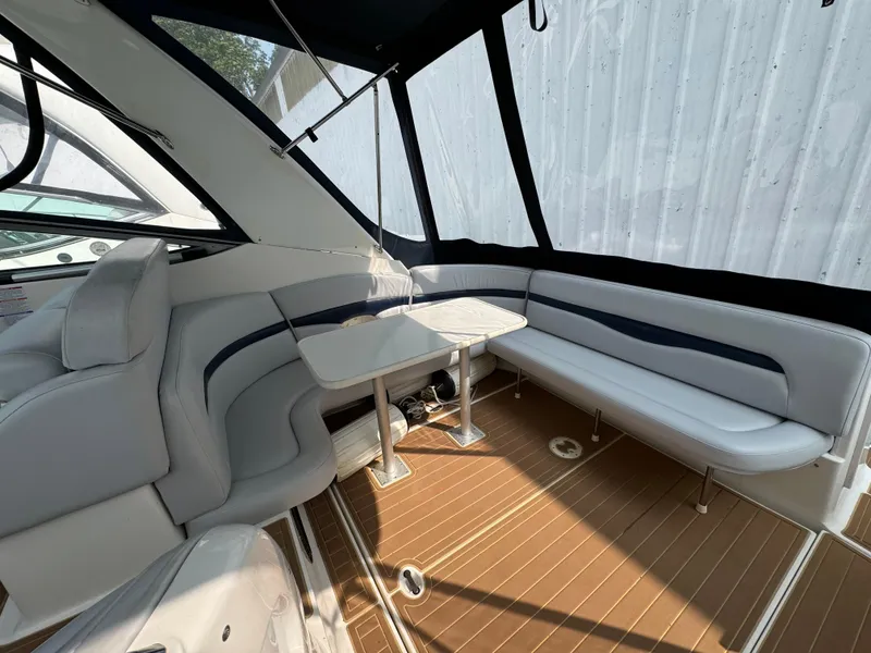 Slide: The Image of 2005 Chaparral Signature 350 boat interior with cushioned seating and table. - 5