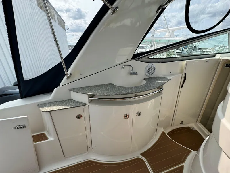 Slide: The Image of 2005 Chaparral Signature 350 boat interior with sink and storage cabinets. - 7