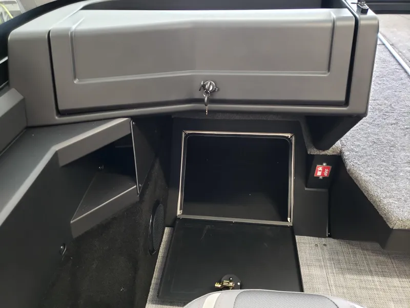 Slide: The Image of 2025 Alumacraft Competitor 175X Sport interior storage compartment with open hatch. - 18