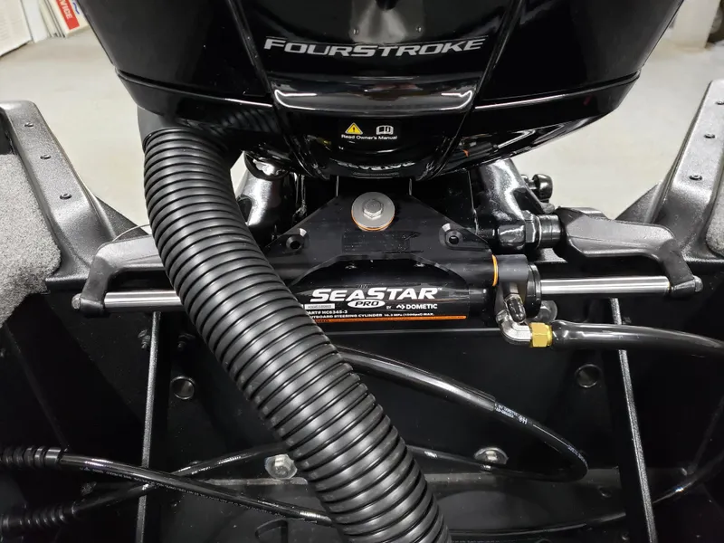 Slide: The Image of 2025 Alumacraft Competitor 175X Sport boat engine with SeaStar Pro hydraulic steering. - 21