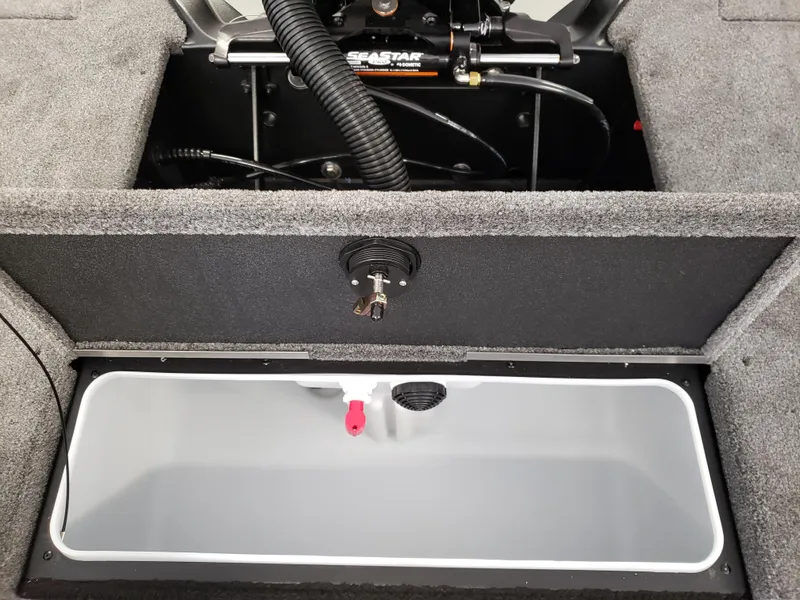 Slide: The Image of 2025 Alumacraft Competitor 175X Sport boat storage compartment with hydraulic system. - 6