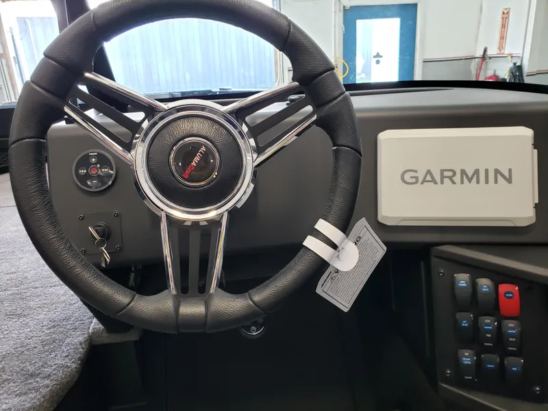 Slide: The Image of 2025 Alumacraft Competitor 175X Sport dashboard with Garmin navigation and steering wheel. - 7