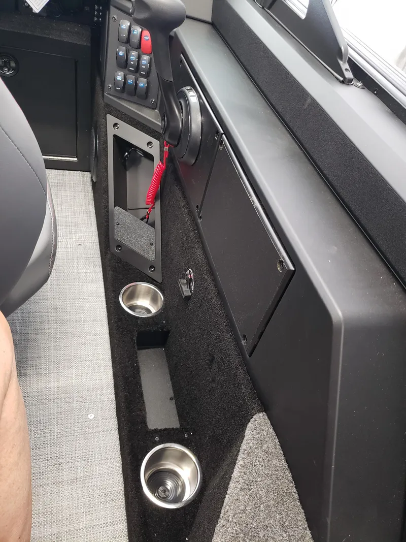 Slide: The Image of Interior of 2025 Alumacraft Competitor 175X Sport boat with control panel and cup holders. - 9