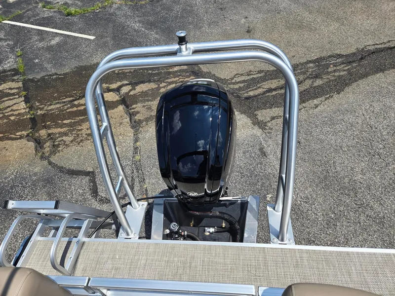 Slide: The Image of 2026 Starcraft LX20R boat with sleek black motor and sturdy metal frame. - 11