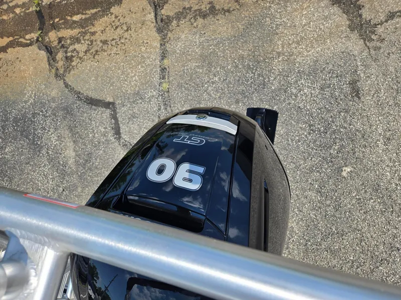 Slide: The Image of Top view of a 2026 Starcraft LX20R boat engine on pavement. - 8