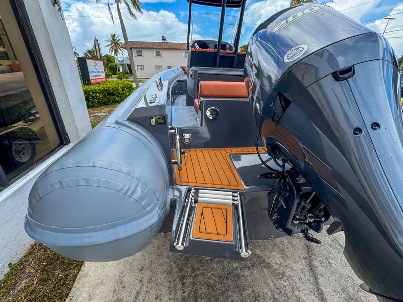 Slide: The Image of 2023 Northstar Orion 7 boat with outboard motor and teak deck, docked outdoors. - 4