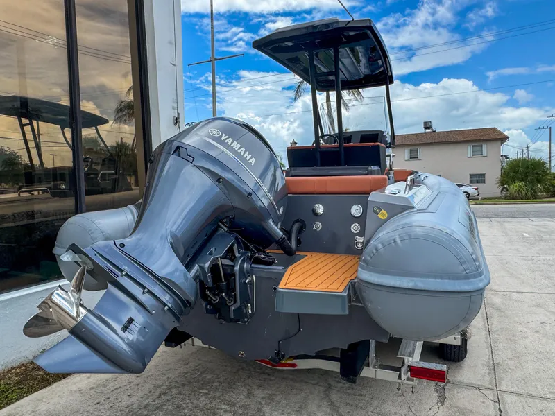 Slide: The Image of 2023 Northstar Orion 7 boat with Yamaha engine, parked outdoors on a sunny day. - 5