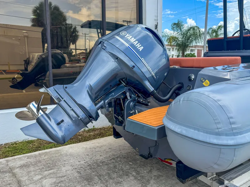 Slide: The Image of 2023 Northstar Orion 7 boat with Yamaha outboard motor, docked near a building. - 6