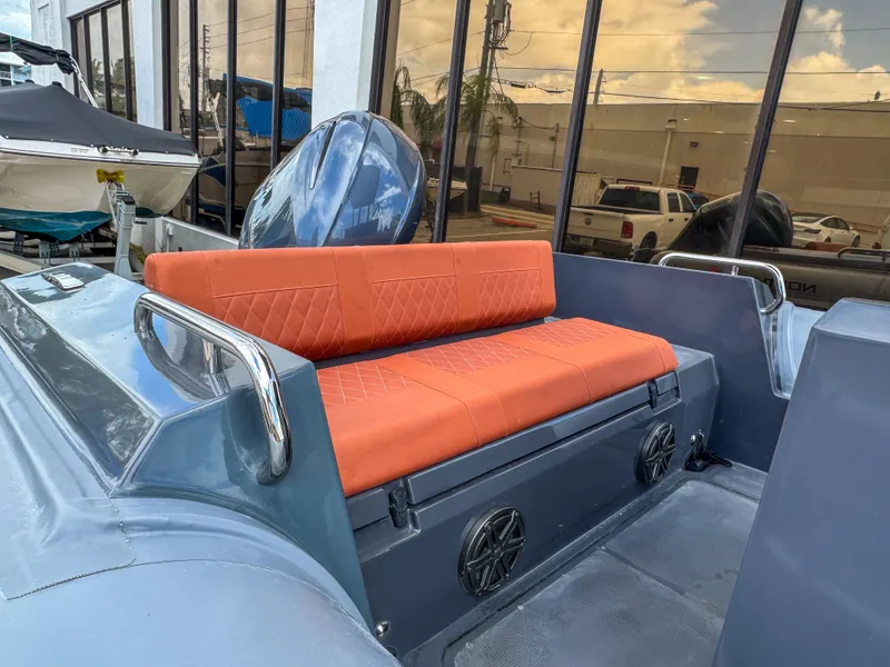 Slide: The Image of 2023 Northstar Orion 7 boat with orange seating and sleek design. - 7