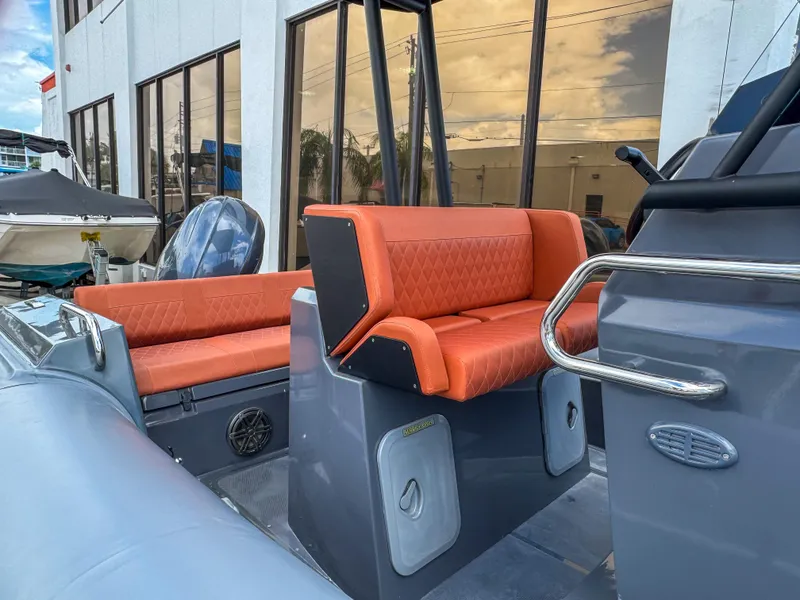 Slide: The Image of 2023 Northstar Orion 7 boat with orange seating and modern design. - 9