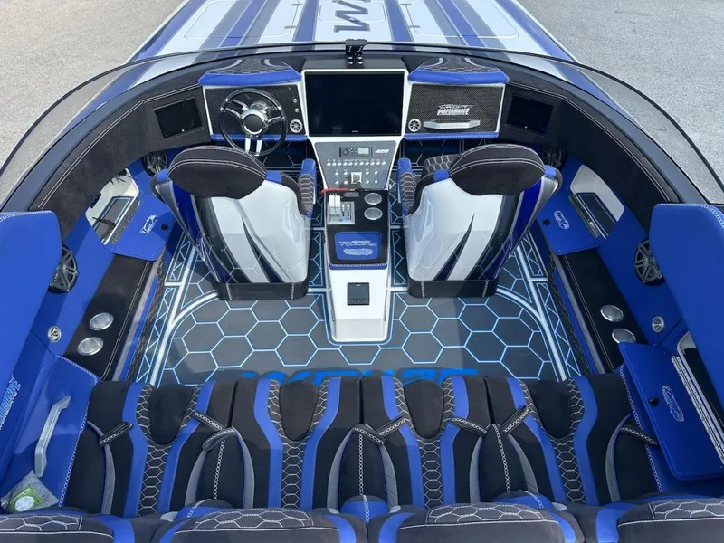 Slide: The Image of Interior of 2018 Wright Performance 420 boat with blue and black seating and hexagonal floor design. - 11