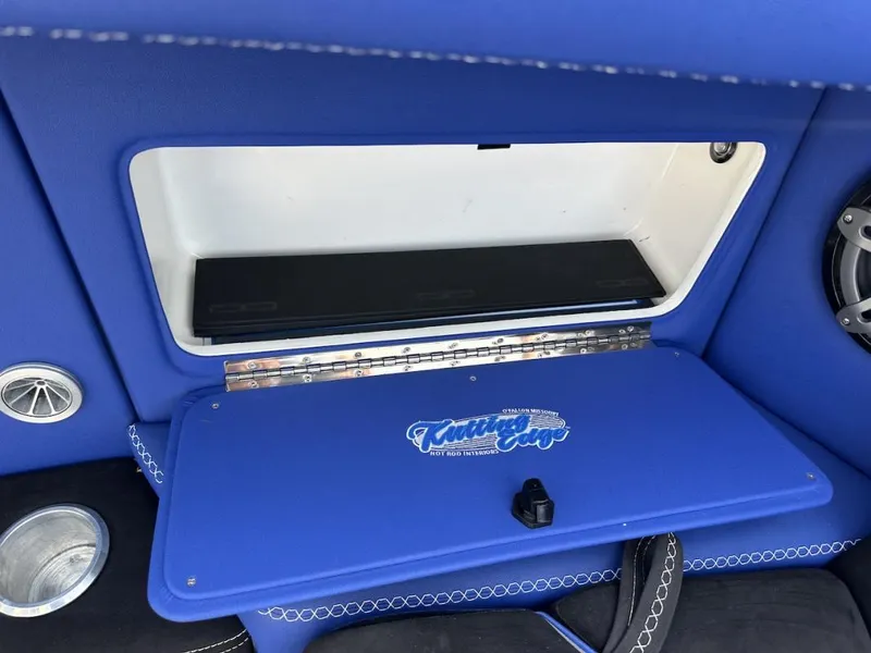 Slide: The Image of Blue interior compartment of 2018 Wright Performance 420 boat with custom audio system. - 13