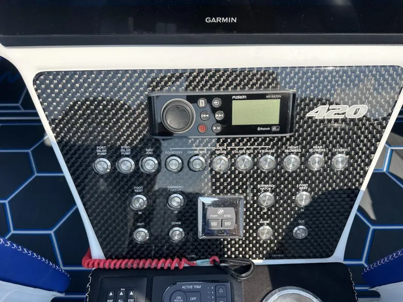 Slide: The Image of Control panel of 2018 Wright Performance 420 boat with carbon fiber finish and various switches. - 16