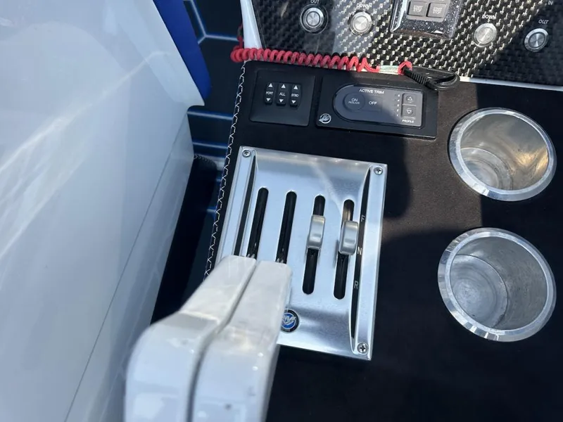Slide: The Image of Control panel of 2018 Wright Performance 420 boat with throttle levers and cup holders. - 17