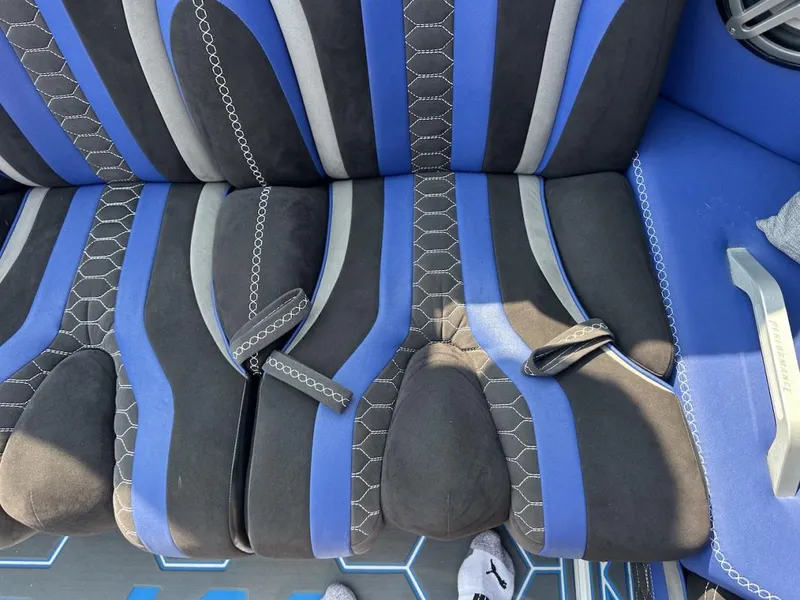Slide: The Image of Blue and black patterned seat in a 2018 Wright Performance 420 boat. - 23