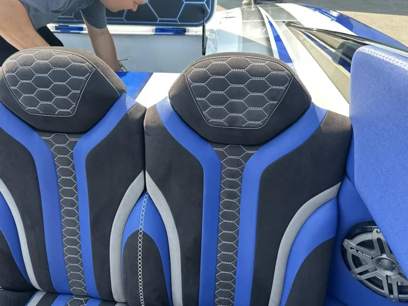 Slide: The Image of Blue and black seats in a 2018 Wright Performance 420 boat interior. - 24