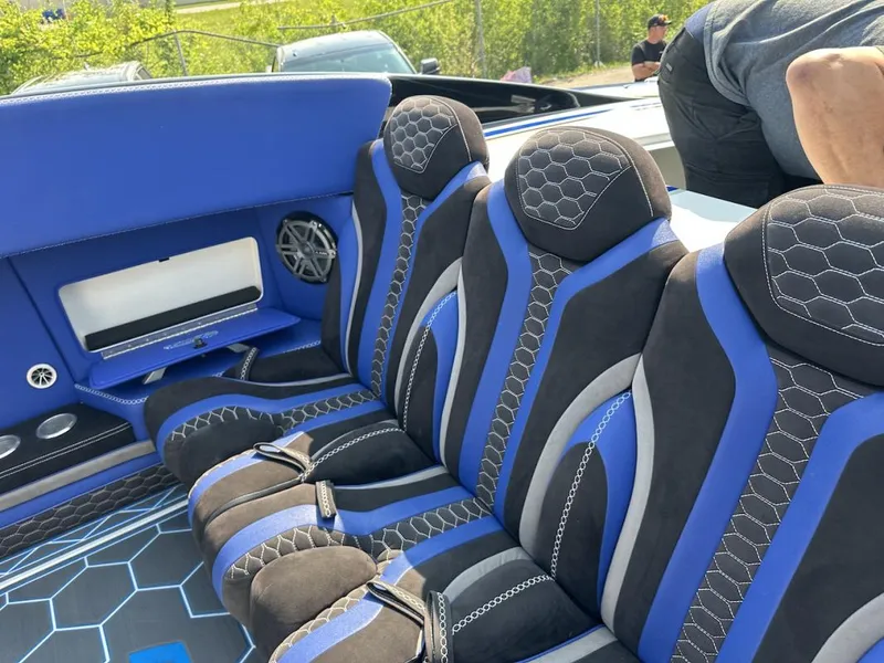 Slide: The Image of Luxurious blue and black interior of 2018 Wright Performance 420 boat with stylish seating. - 25