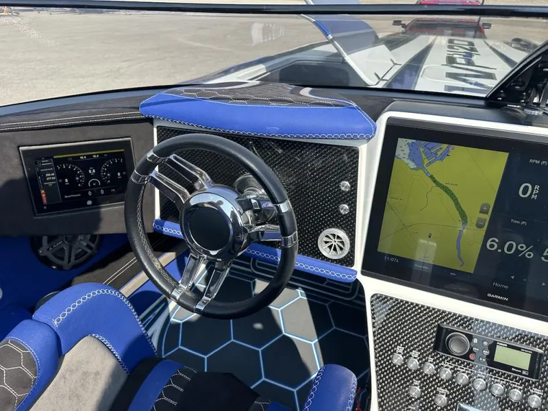 Slide: The Image of Cockpit of 2018 Wright Performance 420 boat with steering wheel and navigation display. - 31