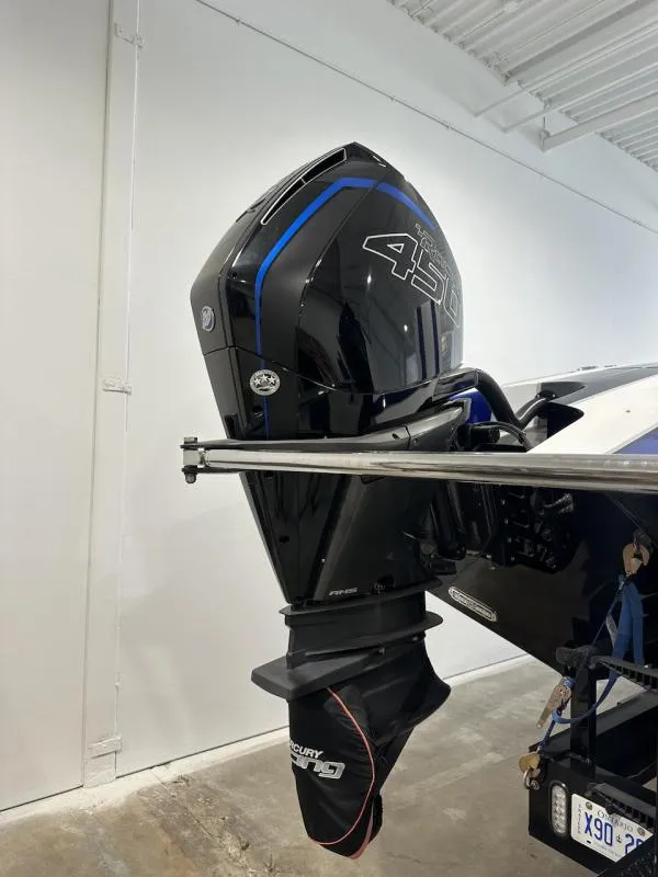 Slide: The Image of 2018 Wright Performance 420 boat engine, black with blue accents, in a garage setting. - 4