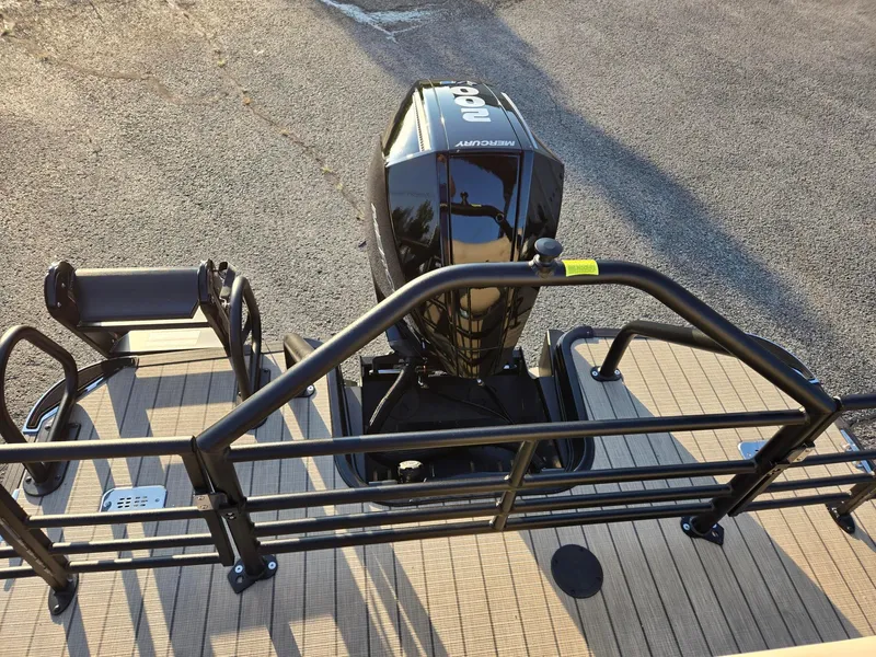 Slide: The Image of 2026 Starcraft EXS3DL boat with Mercury outboard motor, rear deck view. - 12
