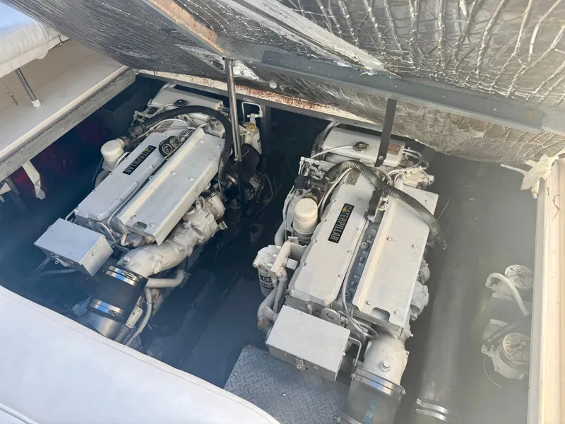Slide: The Image of Engine compartment of a 1999 Sea Ray 400 Sundancer with twin diesel engines. - 3
