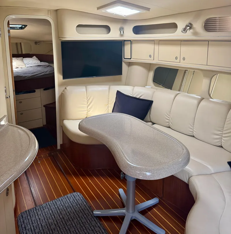 Slide: The Image of Luxurious interior of a 1999 Sea Ray 400 Sundancer yacht with plush seating and modern amenities. - 8