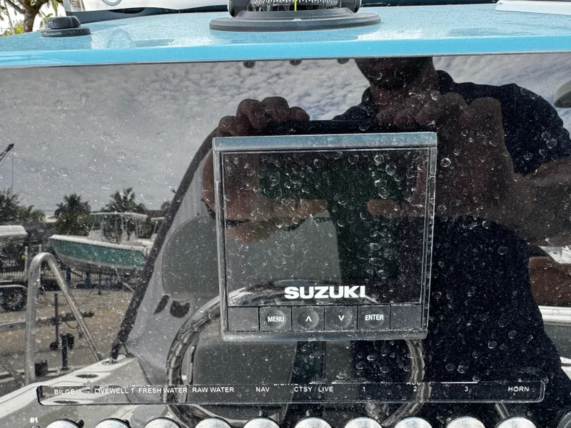 Slide: The Image of Control panel of 2025 Sea Pro 225 Sandbar boat with Suzuki display. - 10