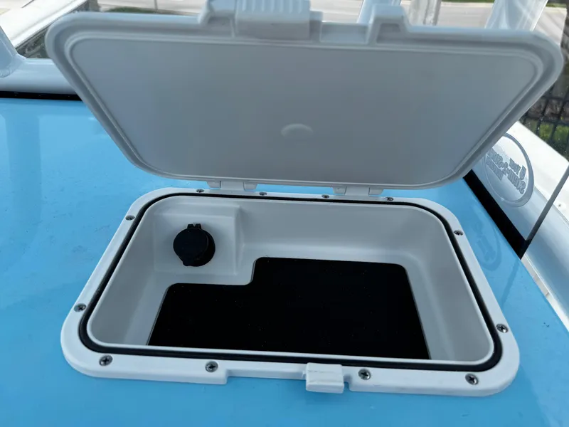 Slide: The Image of Open storage compartment on 2025 Sea Pro 225 Sandbar boat. - 12