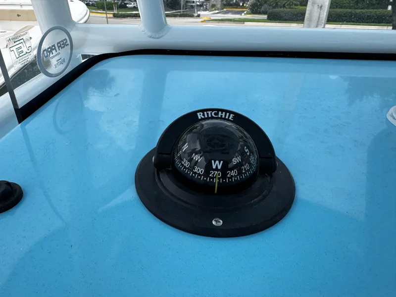 Slide: The Image of Compass on Sea Pro 225 Sandbar boat dashboard, 2025 model. - 13