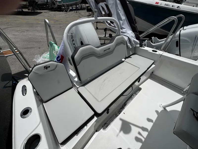 Slide: The Image of 2025 Sea Pro 225 Sandbar boat interior with seating and storage features. - 27