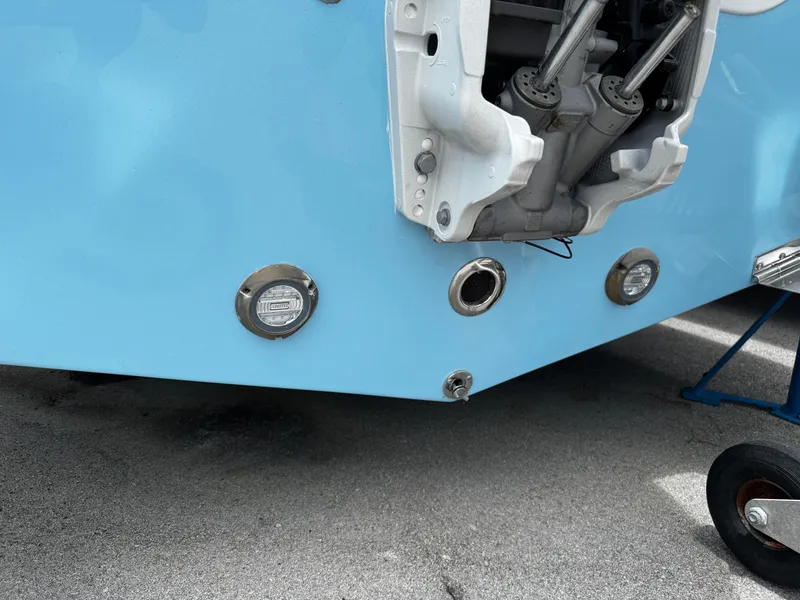 Slide: The Image of 2025 Sea Pro 225 Sandbar boat stern with engine components and lights visible. - 5